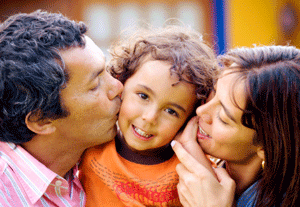 An image of a smiling woman and child